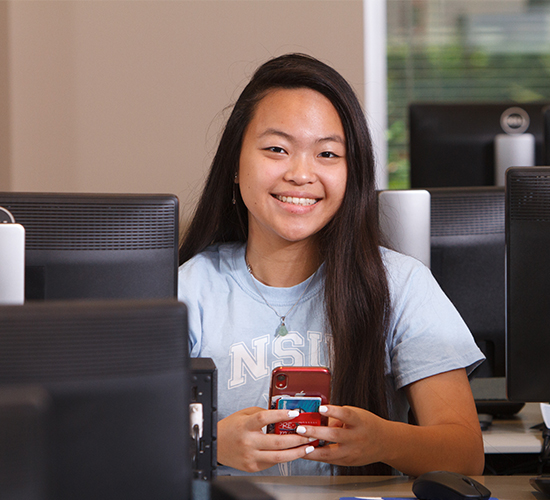 Female student with red cell phone