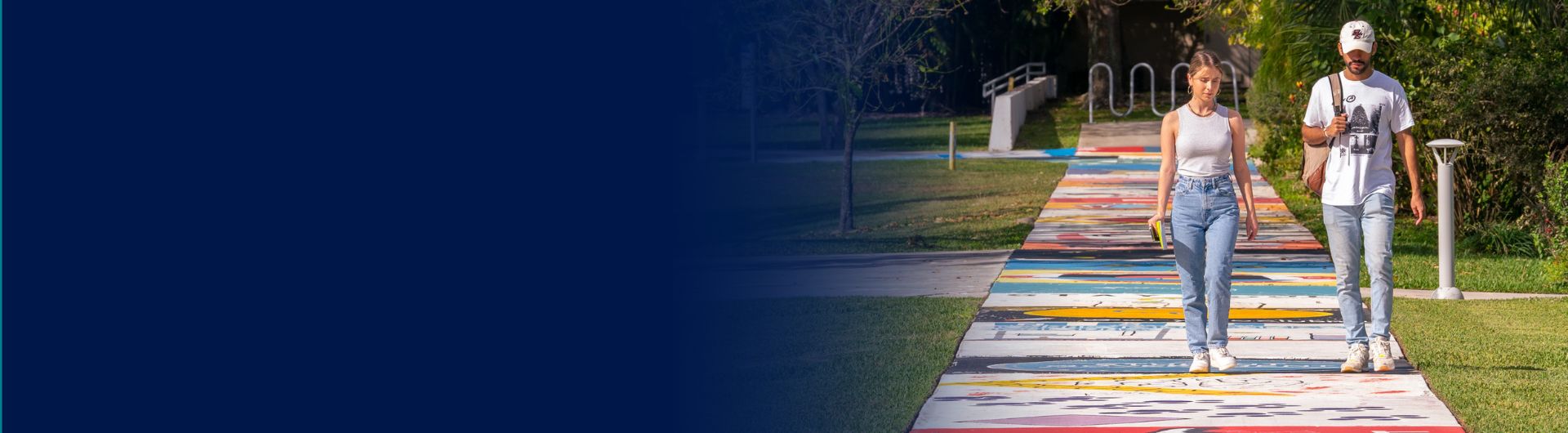 Two students walking on campus