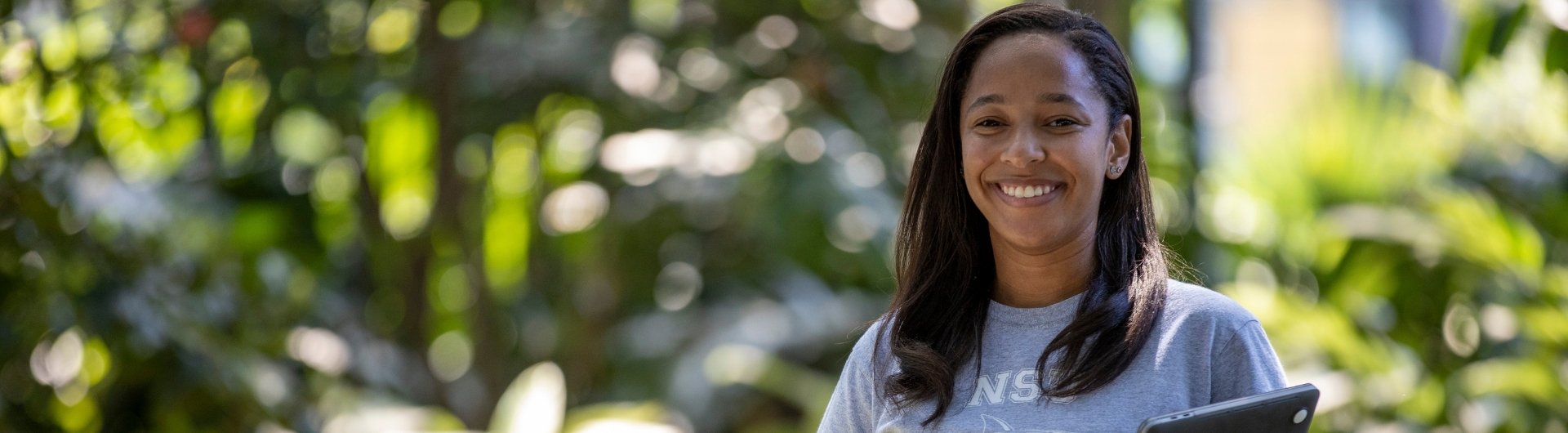 NSU student smiling into camera