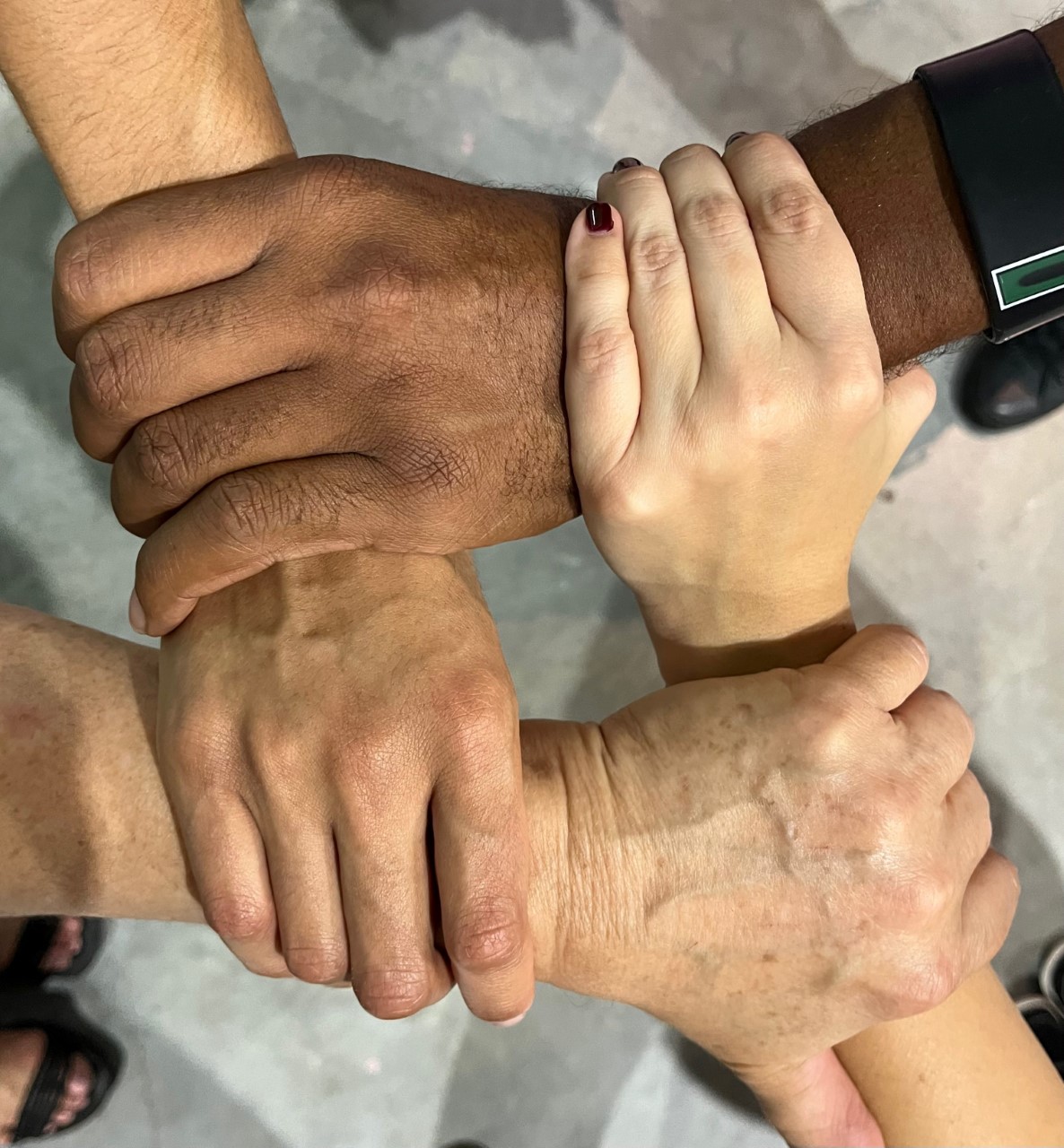 Close-up of hands interlocked