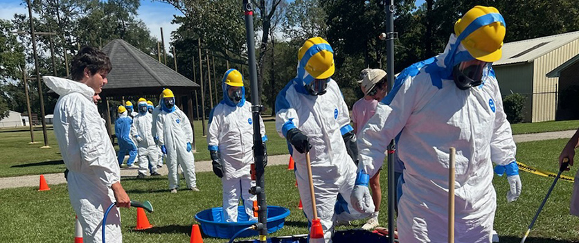 team hazard training in safety suits